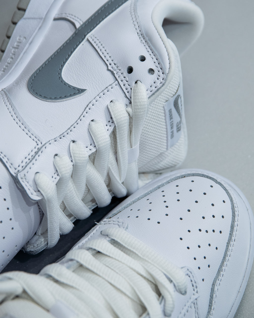 Nike SB Dunk Low ‘Supreme 94 White Metallic Silver’