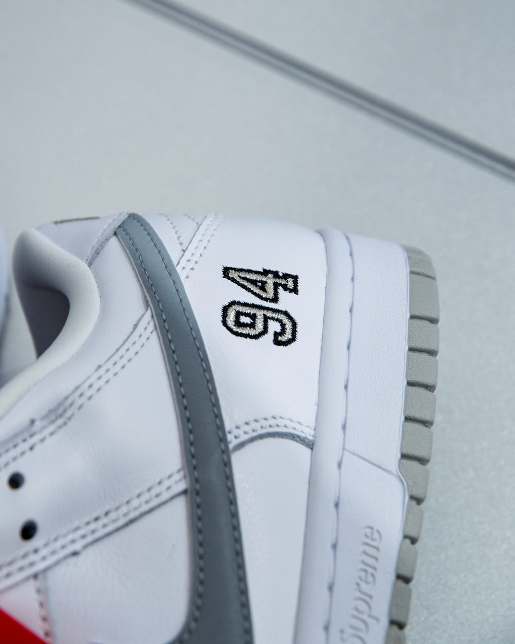 Nike SB Dunk Low ‘Supreme 94 White Metallic Silver’